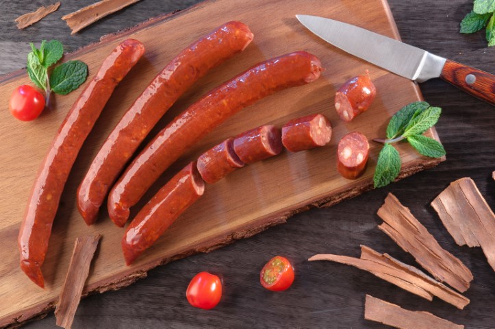 sliced sausage on cutting board
